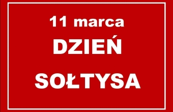 Czerwona tabliczka z napisem 11 marca dzien soltysa
